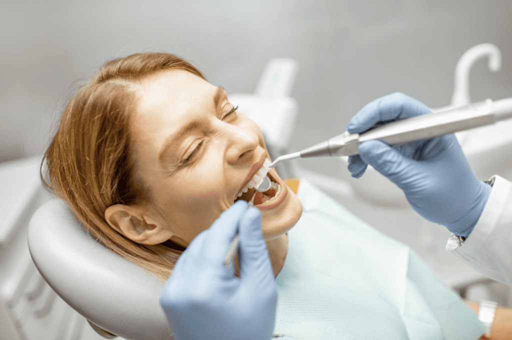 dentist checking patient's teeth