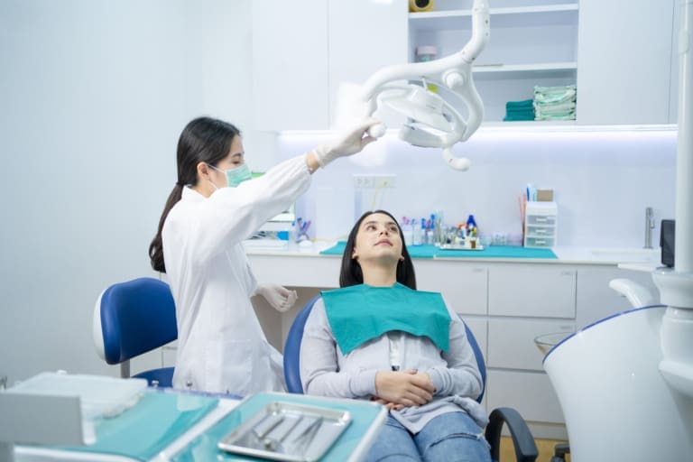 dentist prepare to remove dental plaque