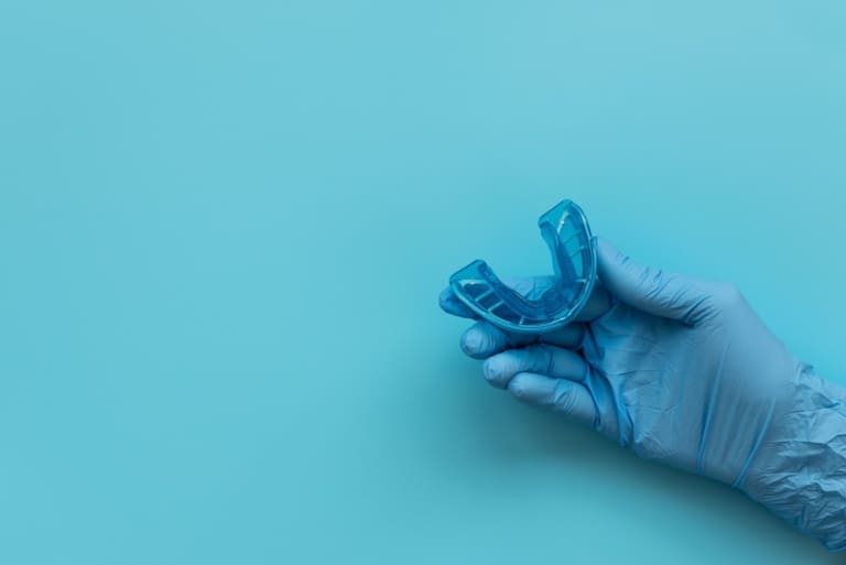 holding a mouthguard