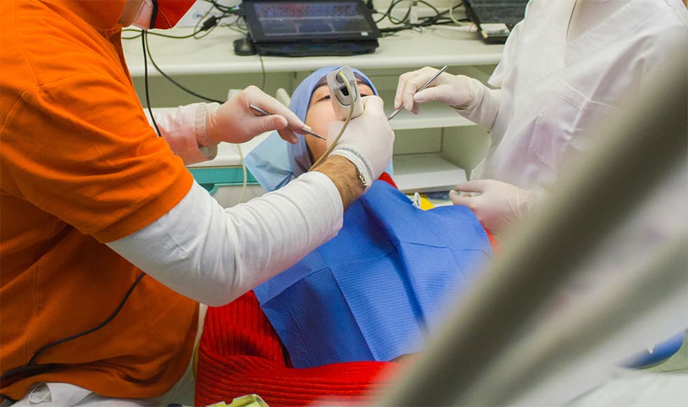 Child receiving a dental exam from their pediatric dentist