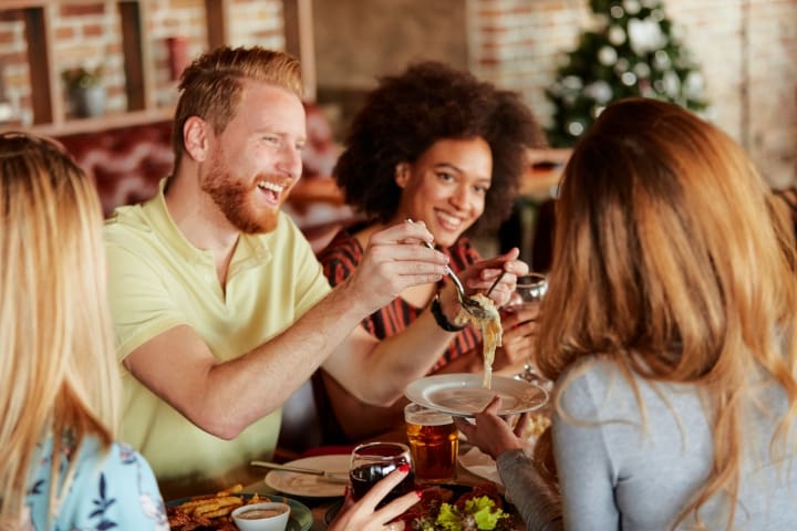 Festive gathering of dentists toasting at a Christmas party