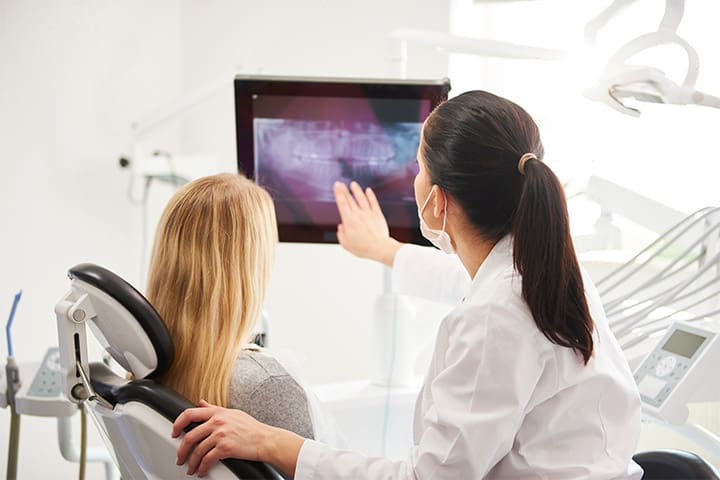 Patient reviewing X-ray with patient