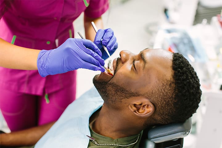 Patient smiling during dental exam