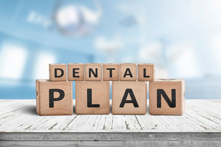Blocks spell “dental plan”.