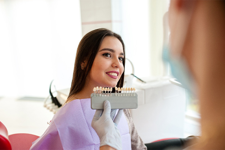 Dentist evaluating a patient’s smile.