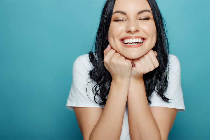 Lady smiles radiantly.