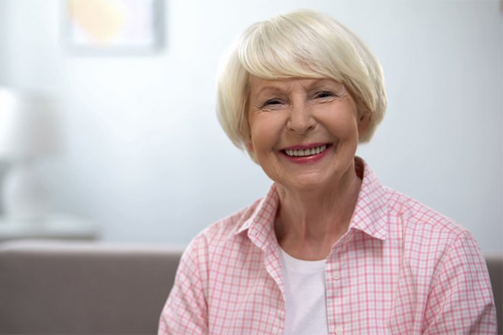 Older woman enjoying life with a healthier smile.