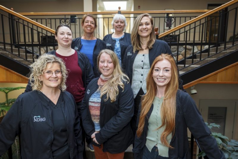 Northampton Dental Specialists Group's staff posing as a group.